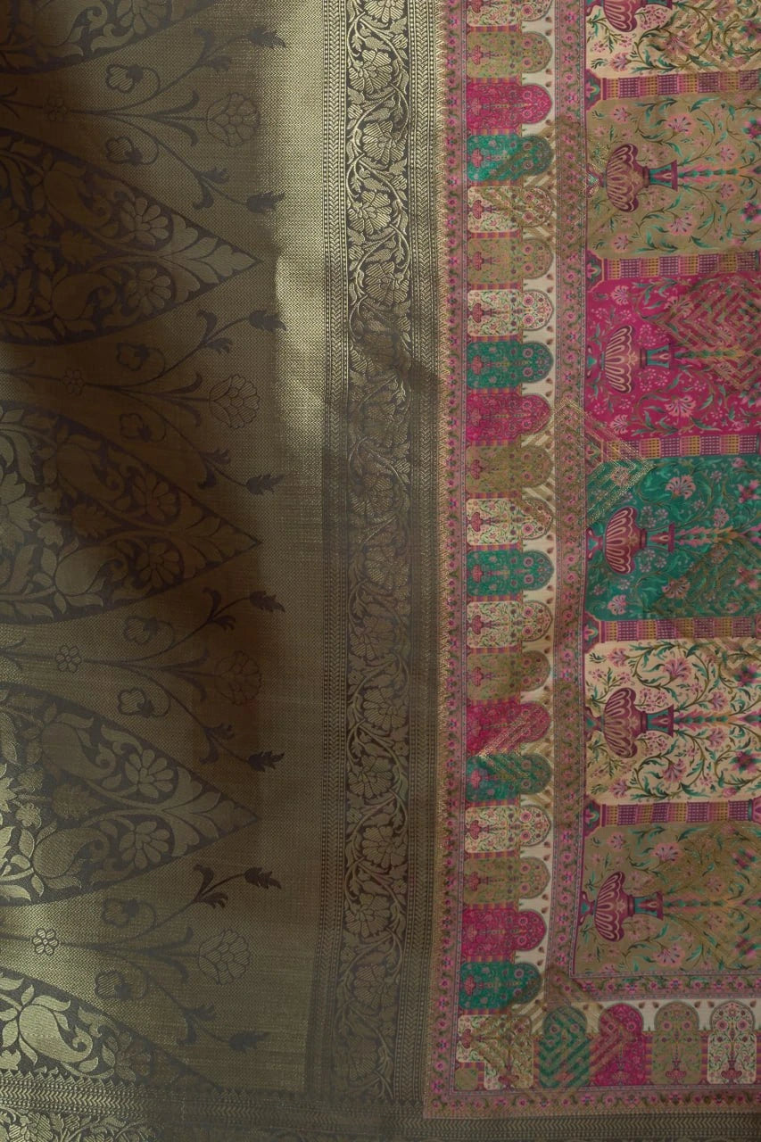 Textile with intricate patterns and designs on a green background